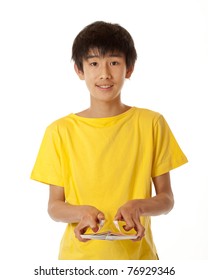 teenage Chinese Asian boy shuffling cards
