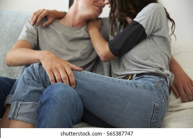 Teenage Couple Embracing At Home, Close Crop