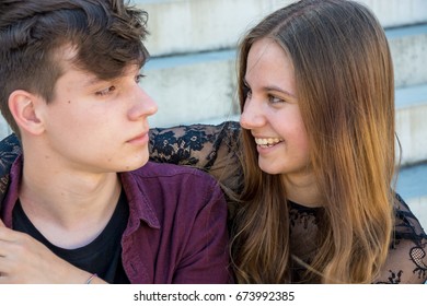 Teenage Couple Feeling In Love Hugging Each Other, Shy Boy And Smiling Girl Full Of Joy