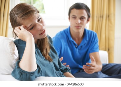 Teenage Couple Having Argument At Home