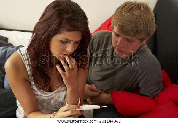 Teenage couple with pregnancy\
test