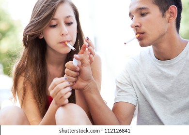 Teenage Couple Smoking