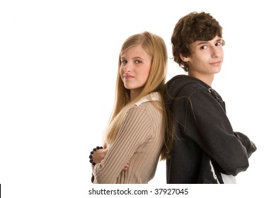 Teenage Couple Standing Back To Back With Arms Crossed Isolated On White Background