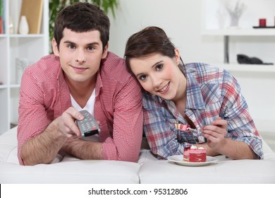 A Teenage Couple Watching TV.