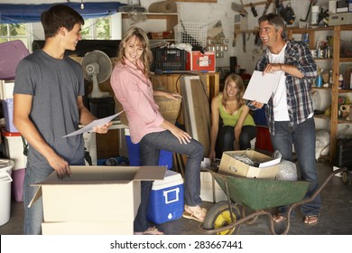 Teenage Family Clearing Garage For Yard Sale