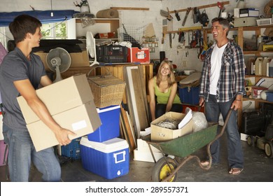 Teenage Family Clearing Garage For Yard Sale