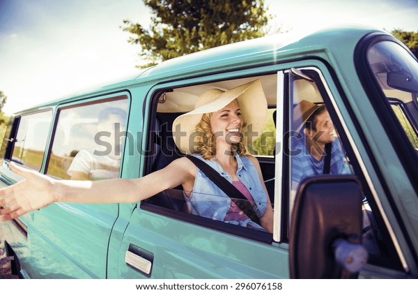 Teenage friends\
on a road trip on a summers day\
