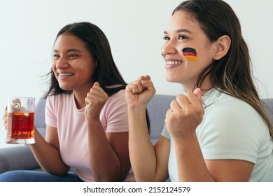 Teenage Friends Watching Germany's Soccer Team Playing At Home