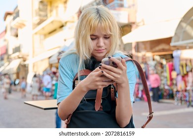 Teenage Girl 16, 17 Years Old With A Smartphone In The City.