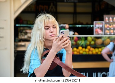 Teenage Girl 16, 17 Years Old With A Smartphone In The City.