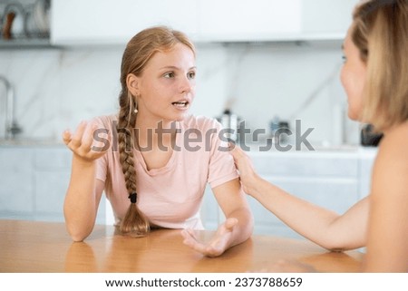Teenage girl admiringly tells unrecognizable mother about plot of new fascinating film and convinces her to watch modern TV series