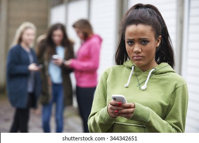 Teenage Girl Being Bullied By text Message