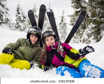 Teenage Girl And Boy Skiing 