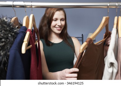 Teenage Girl Choosing Outfit From Wardrobe