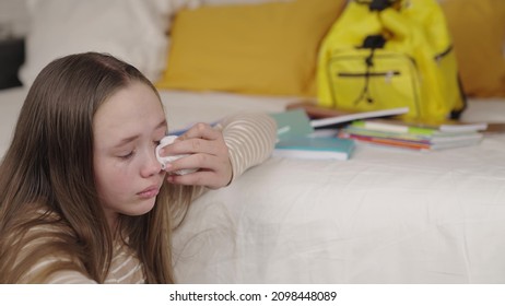 Teenage Girl Crying Wiping Tears From Wet Eyes On Her Face, School Difficulties Upset Child, Resentment Relationships With Peers, Psycho Kid Whims, Sadness And Loneliness With Textbooks And Backpack