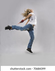 Teenage girl dancing breakdance in action