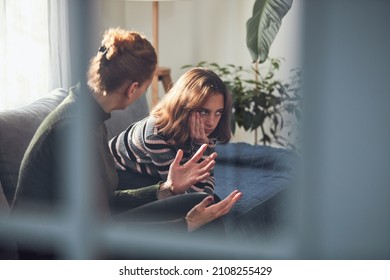 Teenage girl in difficult mood with angry mom.
