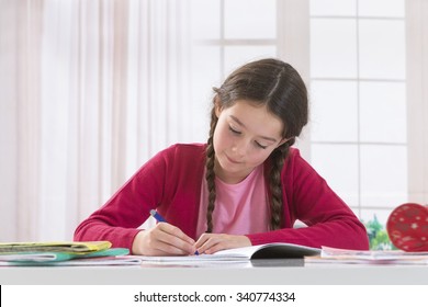 Teenage girl doing homework for school.   