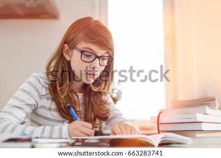 Similar – Image, Stock Photo happy school girl doing homework. Smart child working hard