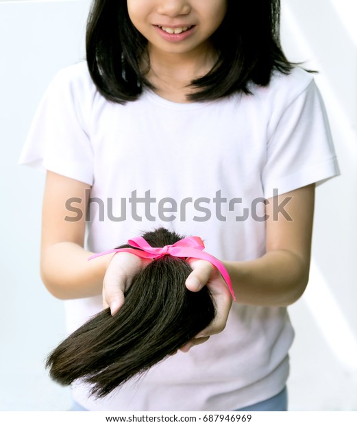 Teenage Girl Donating Her Healthy Hair Stock Image