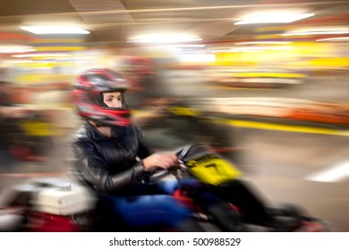 Teenage Girl Driving Go Cart On Track