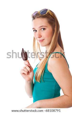 Teenage girl is eating icecream. Isolated on the white background