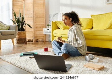 A teenage girl engrossed in e-learning, sitting on the floor with a laptop. - Powered by Shutterstock