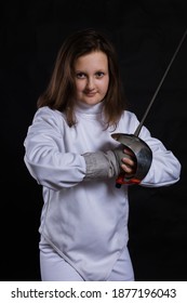 Teenage Girl Fencer Dressed In Uniform With Epee And Helmet