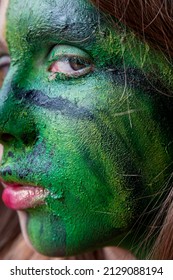 Teenage Girl With Green Make-up Or Face Paint For A Climate Protest, Concept Of Environmental Concern, Going Green