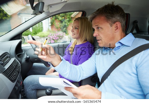 Teenage Girl\
Having Driving Lesson With\
Instructor