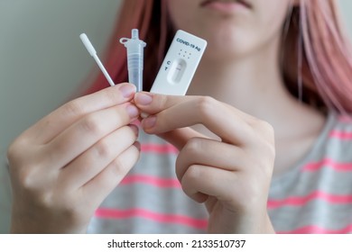 Teenage Girl Holding Covid-19 Rapid Antigen Test Cassette With Negative Result Of Rapid Diagnostic Test.