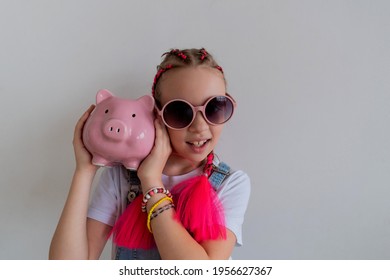 Teenage Girl Learns Financial Literacy. Child Saving Money In Piggy Bank. Future Business Planning Concept.