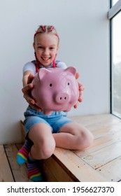 Teenage Girl Learns Financial Literacy. Child Saving Money In Piggy Bank. Future Business Planning Concept.