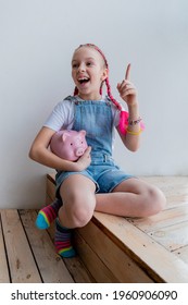 Teenage Girl Learns Financial Literacy. Child Saving Money In Piggy Bank. Future Business Planning Concept.