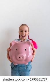 Teenage Girl Learns Financial Literacy. Child Saving Money In Piggy Bank. Future Business Planning Concept.