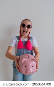 Teenage Girl Learns Financial Literacy. Child Saving Money In Piggy Bank. Future Business Planning Concept.