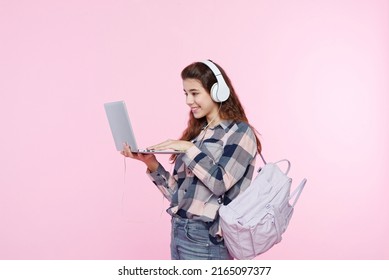 Teenage Girl Looking At Her Laptop, Getting Ready For School And Finishing Homework