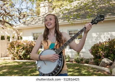 Teenage Girl Playing Banjo