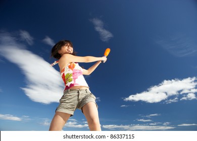 Teenage Girl Playing Baseball On Beach