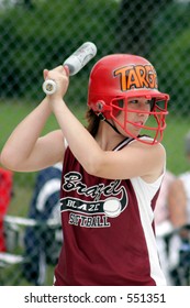 Teenage Girl Playing Softball.