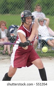 Teenage Girl Playing Softball.