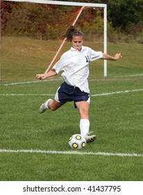 Teenage Girl Ready To Kick Soccer Ball