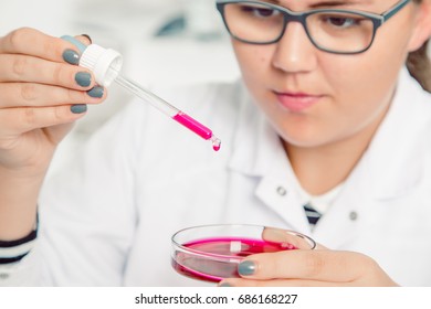 A Teenage Girl In A School Laboratory In Chemistry.High School Student. Student Working At Laboratory Class