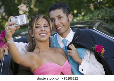 Teenage Girl Snapping Photo At Prom