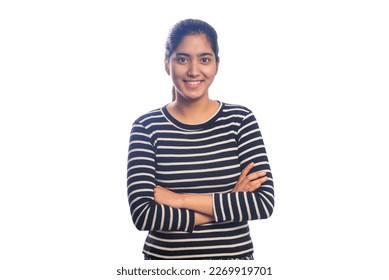 Teenage girl standing with arms crossed against white background