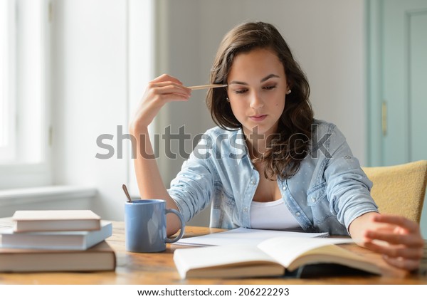 teenage-girl-studying-reading-book-600w-206222293.jpg