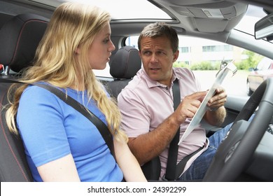 Teenage Girl Taking A Driving Lesson