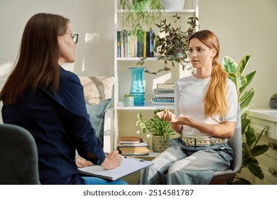 Teenage girl at therapy session with mental health professional - Powered by Shutterstock