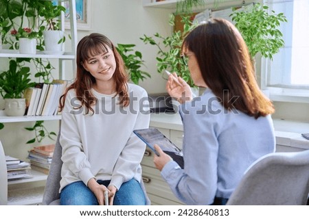 Teenage girl at therapy session with mental health professional
