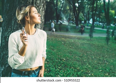 Teenage Girl Using Electronic Cigarette